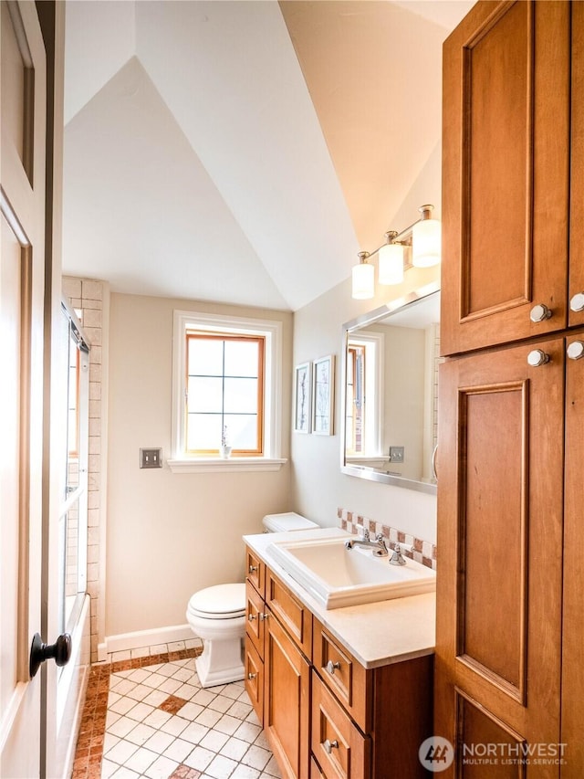 8314 Island Dr S, Seattle, WA 98118 - full bathroom with vanity, vaulted ceiling,  shower combination, and tile patterned flooring