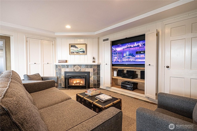 8314 Island Dr S, Seattle, WA 98118 - living area featuring a decorative wall, carpet, a tiled fireplace, and recessed lighting