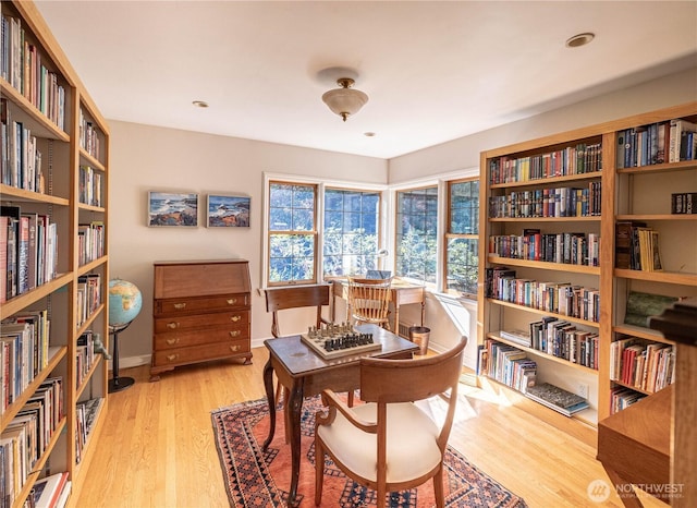 8314 Island Dr S, Seattle, WA 98118 - home office featuring wall of books and wood finished floors