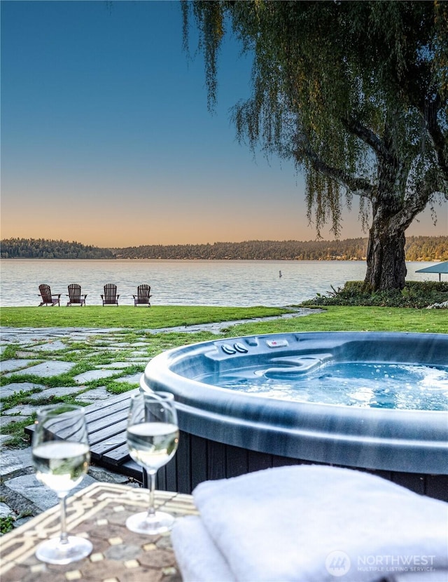8314 Island Dr S, Seattle, WA 98118 - pool at dusk featuring a hot tub and a water view
