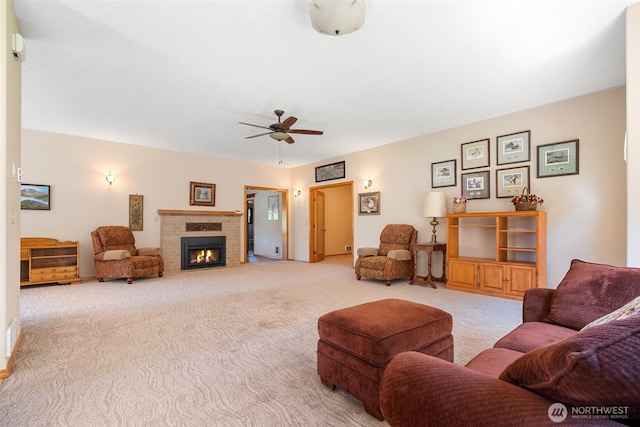 735 Coal Creek Rd, Chehalis, WA 98532 - living area featuring carpet, a warm lit fireplace, and ceiling fan