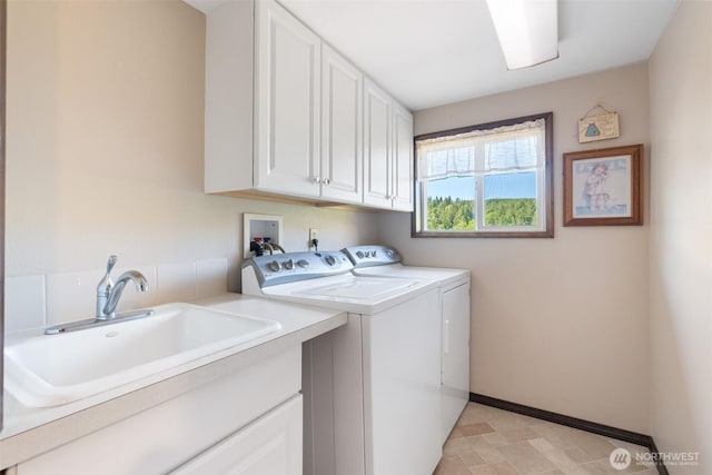 735 Coal Creek Rd, Chehalis, WA 98532 - washroom featuring cabinet space, washing machine and clothes dryer, and baseboards