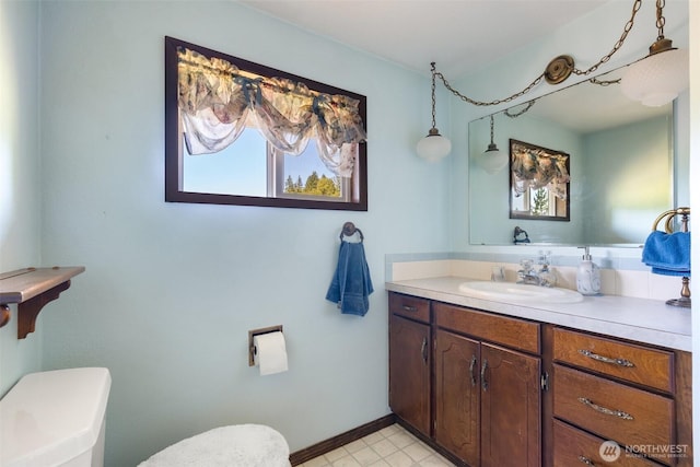 735 Coal Creek Rd, Chehalis, WA 98532 - bathroom featuring toilet, vanity, and baseboards