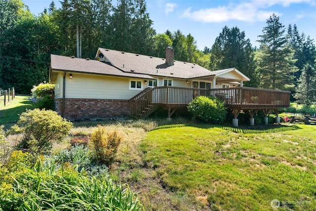 735 Coal Creek Rd, Chehalis, WA 98532 - back of house with brick siding, a yard, a wooden deck, and a chimney