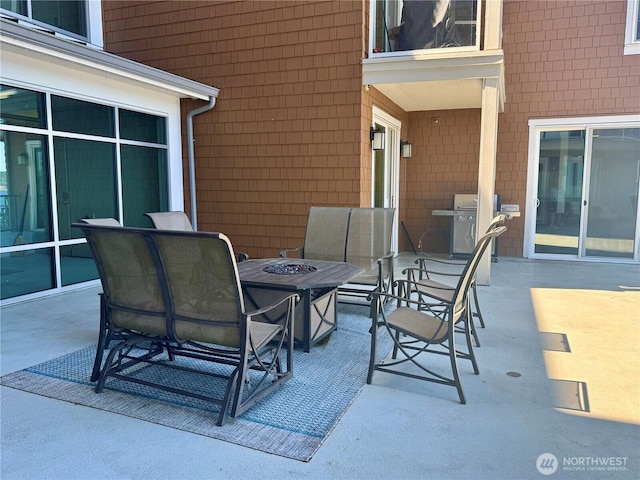 5105 Grand Loop Unit 107, Tacoma, WA 98407 - view of patio / terrace with an outdoor fire pit and grilling area