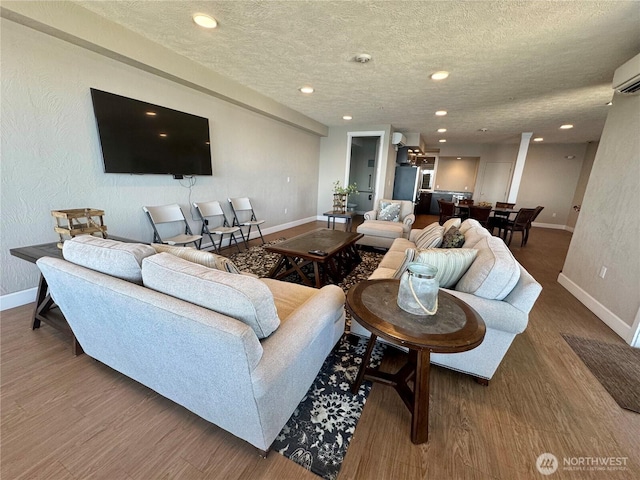 5105 Grand Loop Unit 107, Tacoma, WA 98407 - living area featuring baseboards, wood finished floors, recessed lighting, and a textured ceiling