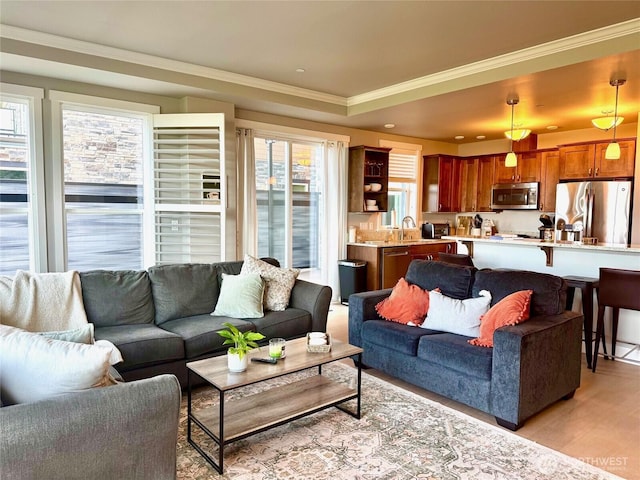 5105 Grand Loop Unit 107, Tacoma, WA 98407 - living room with crown molding and light wood-style floors