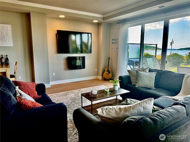 5105 Grand Loop Unit 107, Tacoma, WA 98407 - living room with ornamental molding, wood finished floors, baseboards, and recessed lighting