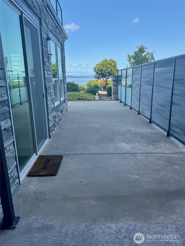 5105 Grand Loop Unit 107, Tacoma, WA 98407 - view of patio with a water view