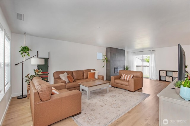 1860 Hoffman Hill Blvd, Dupont, WA 98327 - living area featuring light wood-type flooring and baseboards
