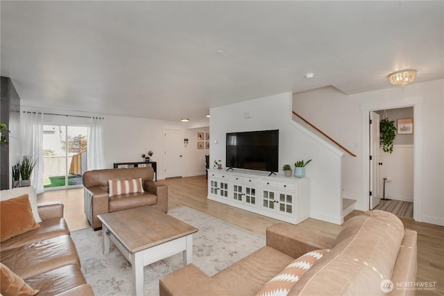 1860 Hoffman Hill Blvd, Dupont, WA 98327 - living area with light wood-style flooring, stairway, and baseboards