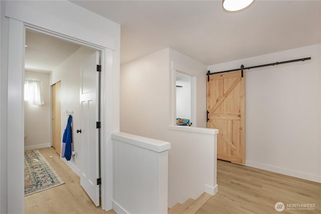 1860 Hoffman Hill Blvd, Dupont, WA 98327 - hall with light wood finished floors, an upstairs landing, baseboards, and a barn door