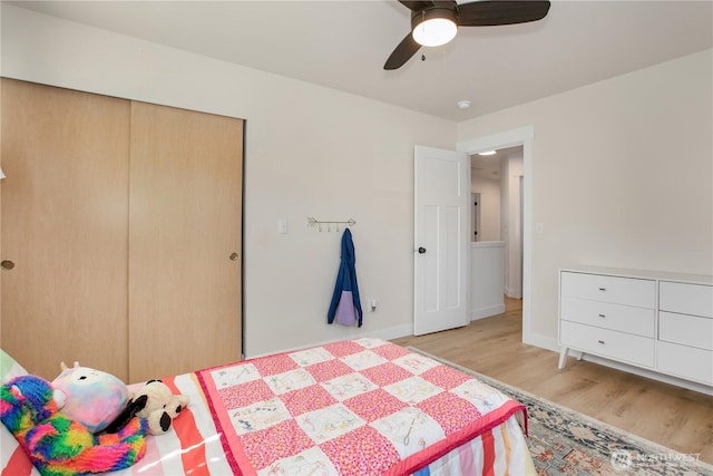 1860 Hoffman Hill Blvd, Dupont, WA 98327 - bedroom featuring wood finished floors, a ceiling fan, baseboards, and a closet