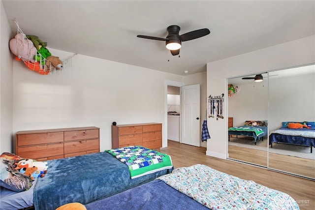 1860 Hoffman Hill Blvd, Dupont, WA 98327 - bedroom with wood finished floors, ceiling fan, a closet, and baseboards