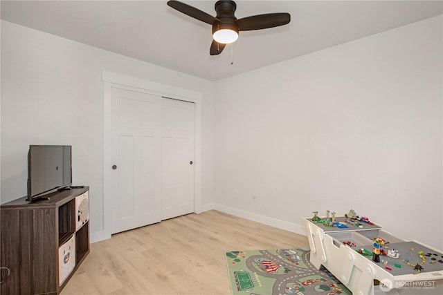 1860 Hoffman Hill Blvd, Dupont, WA 98327 - playroom featuring light wood finished floors, a ceiling fan, and baseboards