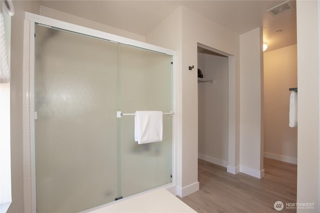 1860 Hoffman Hill Blvd, Dupont, WA 98327 - bathroom featuring wood finished floors, a shower stall, and baseboards