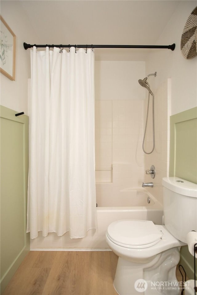 1860 Hoffman Hill Blvd, Dupont, WA 98327 - bathroom with toilet, shower / bathtub combination with curtain, and wood finished floors