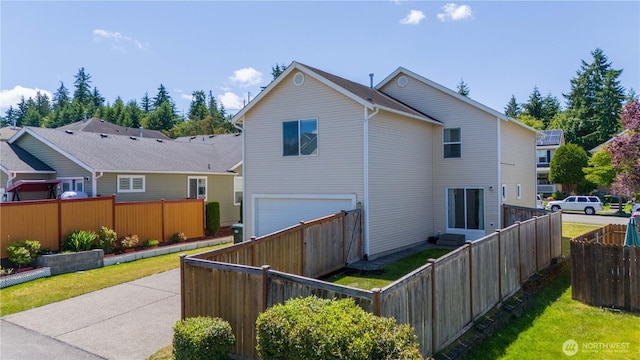 1860 Hoffman Hill Blvd, Dupont, WA 98327 - back of house featuring a garage