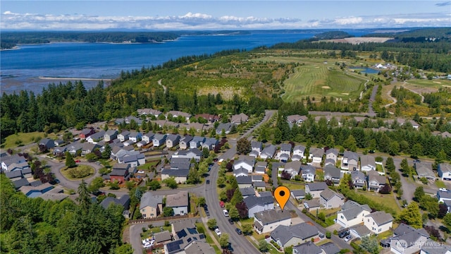 1860 Hoffman Hill Blvd, Dupont, WA 98327 - aerial view of property and surrounding area featuring a large body of water and nearby suburban area