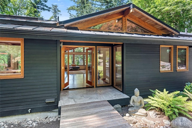 9767 Battle Point Dr NE, Bainbridge Island, WA 98110 - view of exterior entry featuring a standing seam roof and a metal roof