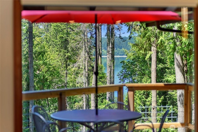 9767 Battle Point Dr NE, Bainbridge Island, WA 98110 - sunroom with a water view and a view of trees