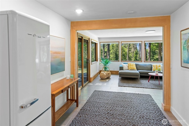 9767 Battle Point Dr NE, Bainbridge Island, WA 98110 - sunroom / solarium with tile patterned floors and baseboards