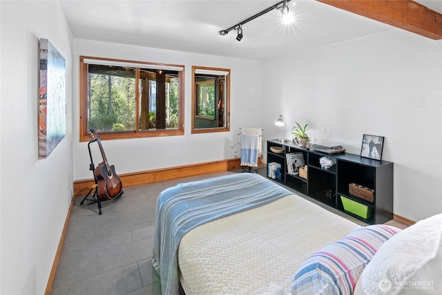 9767 Battle Point Dr NE, Bainbridge Island, WA 98110 - bedroom with track lighting and tile patterned flooring