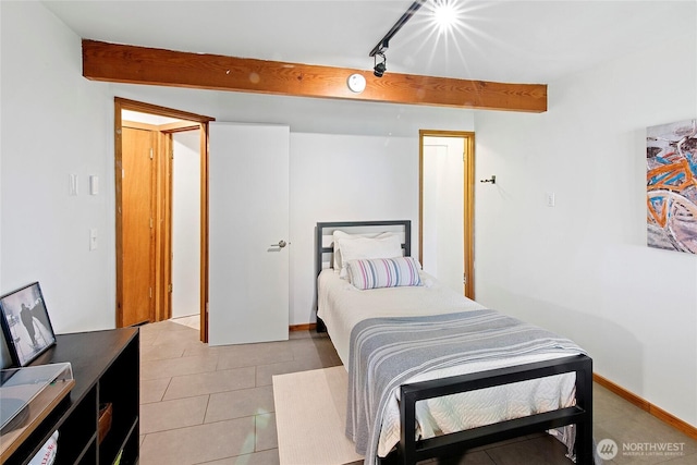 9767 Battle Point Dr NE, Bainbridge Island, WA 98110 - bedroom with light tile patterned flooring and beamed ceiling