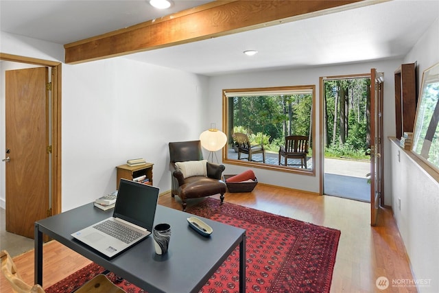 9767 Battle Point Dr NE, Bainbridge Island, WA 98110 - home office with healthy amount of natural light, wood finished floors, beamed ceiling, and recessed lighting