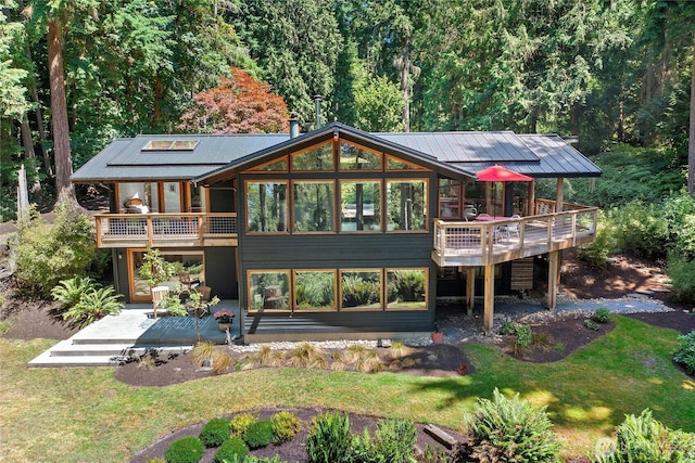 9767 Battle Point Dr NE, Bainbridge Island, WA 98110 - back of house featuring a patio, a lawn, and a wooden deck