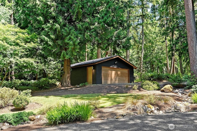 9767 Battle Point Dr NE, Bainbridge Island, WA 98110 - view of outbuilding featuring a forest view