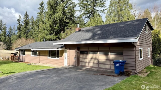 13676 197th Ave SE, Renton, WA 98059 - view of front facade featuring a front lawn, roof with shingles, and a chimney