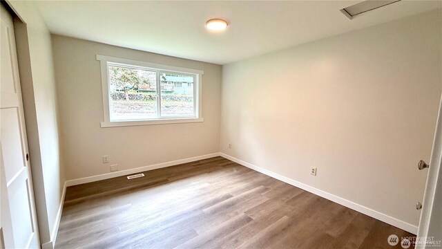 13676 197th Ave SE, Renton, WA 98059 - unfurnished room featuring wood finished floors and baseboards