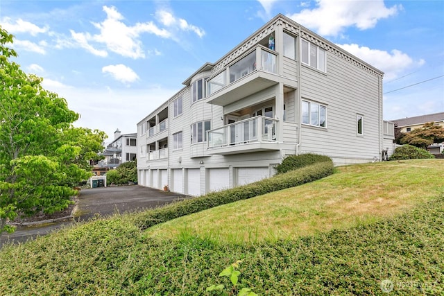 912 11th Unit 101, Bellingham, WA 98225 - back of house featuring a balcony and a yard