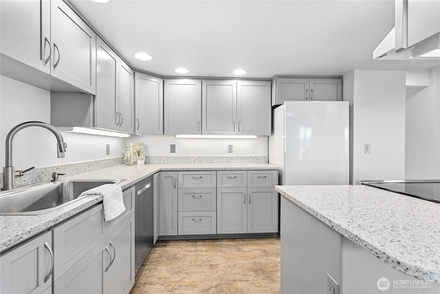 912 11th Unit 101, Bellingham, WA 98225 - kitchen with freestanding refrigerator, a sink, stainless steel dishwasher, gray cabinetry, and recessed lighting