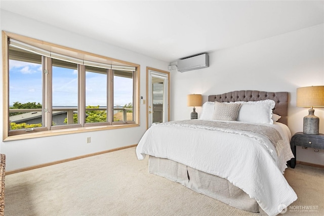 912 11th Unit 101, Bellingham, WA 98225 - bedroom featuring a wall unit AC, baseboards, and carpet flooring