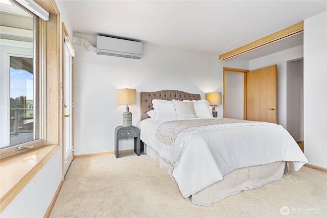 912 11th Unit 101, Bellingham, WA 98225 - carpeted bedroom featuring an AC wall unit, baseboards, and access to exterior
