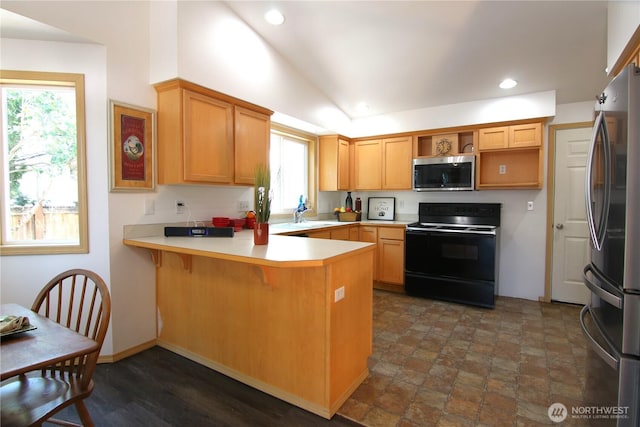 8422 NE 176th St, Arlington, WA 98223 - kitchen with appliances with stainless steel finishes, a peninsula, recessed lighting, lofted ceiling, and plenty of natural light