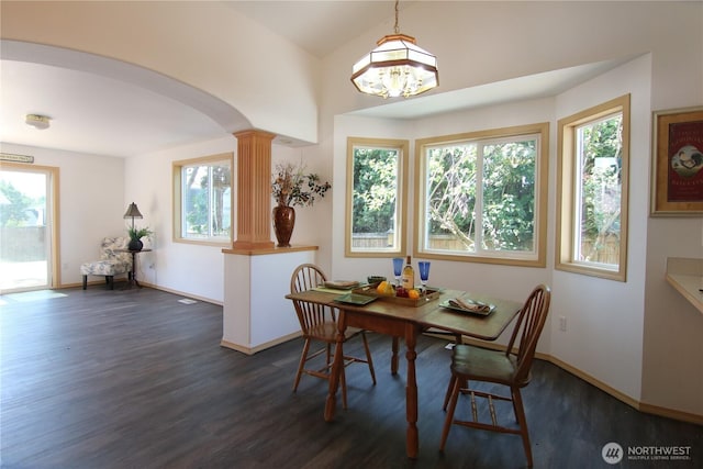 8422 NE 176th St, Arlington, WA 98223 - dining area with decorative columns, arched walkways, dark wood finished floors, baseboards, and a chandelier