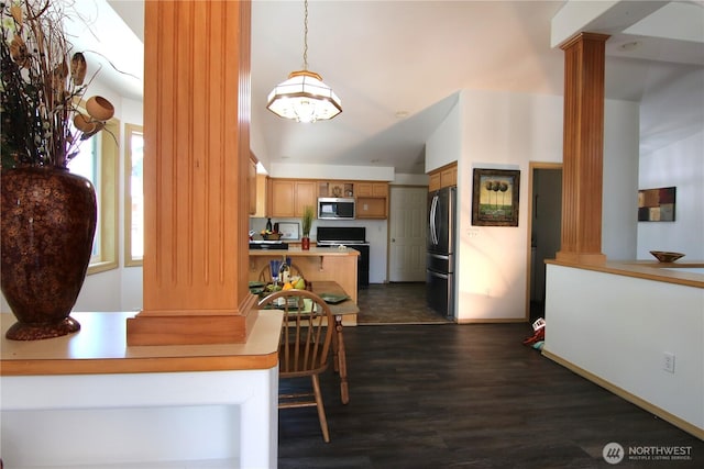 8422 NE 176th St, Arlington, WA 98223 - dining room featuring ornate columns, a chandelier, dark wood finished floors, and baseboards