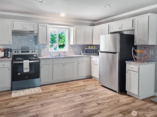 6240 Azure Way, Maple Falls, WA 98266 - kitchen featuring stainless steel appliances, a sink, under cabinet range hood, white cabinets, and light countertops