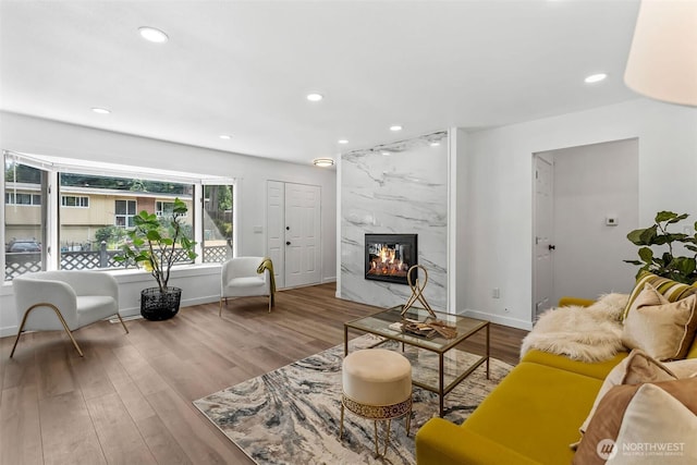 638 SW 299th Pl, Federal Way, WA 98023 - living area with wood finished floors, a high end fireplace, and recessed lighting
