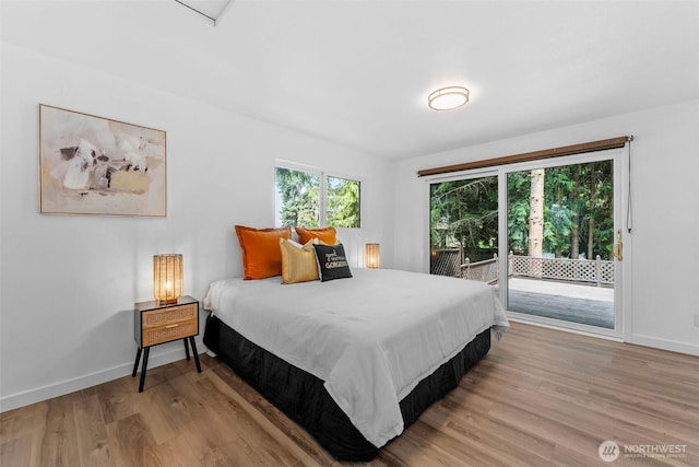 638 SW 299th Pl, Federal Way, WA 98023 - bedroom featuring access to outside and light wood-style flooring