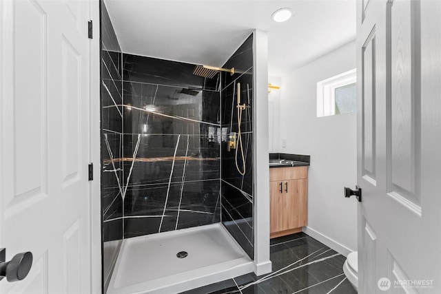 638 SW 299th Pl, Federal Way, WA 98023 - bathroom featuring vanity, a shower stall, and marble look tiles