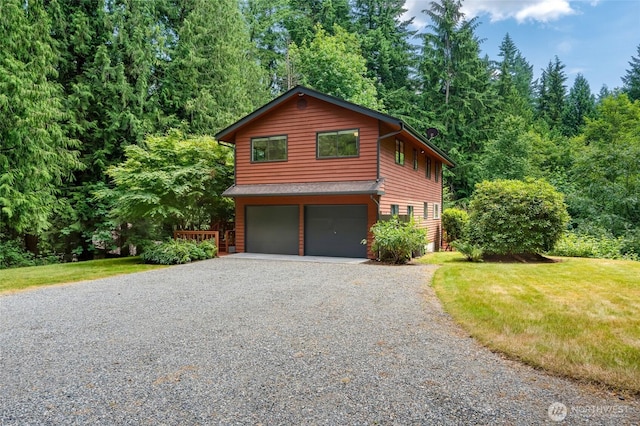 726 114th St NE, Tulalip, WA 98271 - chalet / cabin with driveway, a garage, and a front yard
