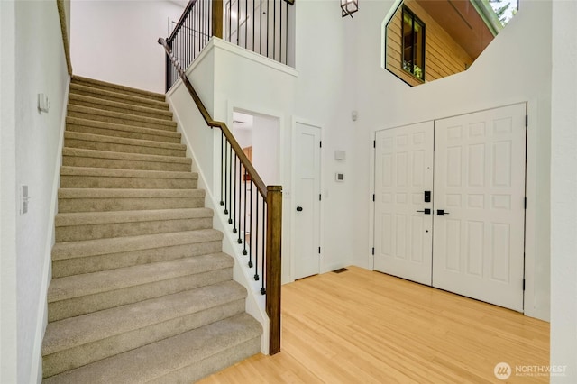 726 114th St NE, Tulalip, WA 98271 - entrance foyer with a towering ceiling, wood finished floors, and stairs