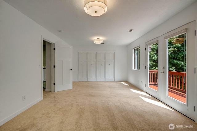 726 114th St NE, Tulalip, WA 98271 - unfurnished bedroom featuring access to exterior, carpet floors, and a closet