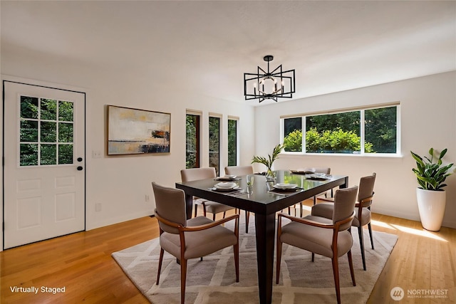 726 114th St NE, Tulalip, WA 98271 - dining area with a chandelier and light wood-style floors