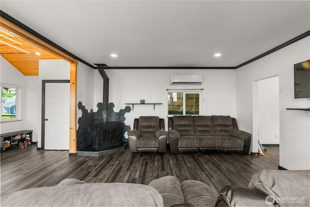 908 N Jeffries St, Aberdeen, WA 98520 - living area featuring an AC wall unit, wood finished floors, and recessed lighting