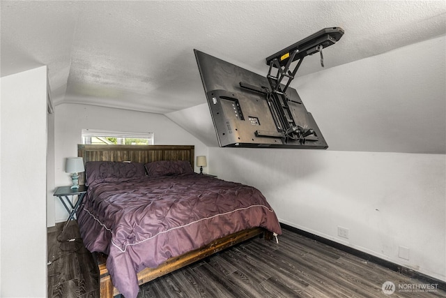 908 N Jeffries St, Aberdeen, WA 98520 - bedroom with lofted ceiling, wood finished floors, and a textured ceiling